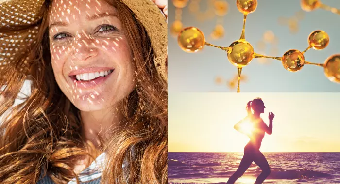 Mulher sorri enquanto segura seu chapéu após tomar suplemento vitamina D ao lado de uma mulher se exercitando à beira da praia no pôr do sol.